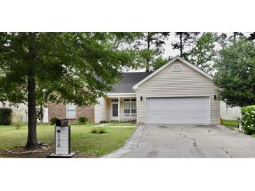 Charming one-story home featuring brick and vinyl siding, a two-car garage, and a well-maintained lawn at 126 Clovis Circle, Myrtle Beach, SC 29579