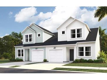 Charming townhomes showcase unique facades, attached garages, and landscaped lawns at 1780 Hunting Harris Ct # 19, Ocean Isle Beach, NC 28469