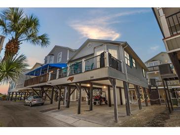 Charming elevated beach home with covered parking and a spacious balcony, perfect for coastal living at 6001 - 1082 S Kings Hwy., Myrtle Beach, SC 29575
