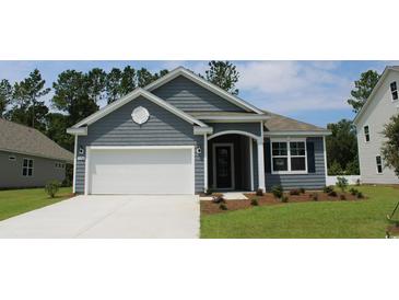 Charming single-Gathering home with gray siding, white trim, and a well-manicured lawn at 1500 Wood Stork Dr., Conway, SC 29526