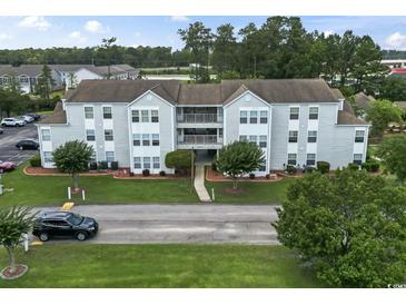 Well-maintained apartment complex with manicured lawn and landscaping at 2280 Andover Dr. # L, Surfside Beach, SC 29575