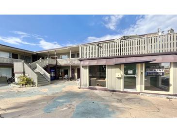 Charming multi-story building featuring inviting stairs, a Pepsi vending machine, and a visible 'For Rent' sign at 403 6Th Ave. S, Myrtle Beach, SC 29577
