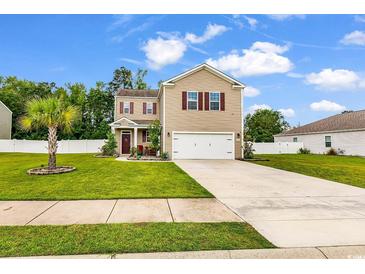 Charming two-story home featuring a well-manicured lawn and a classic neutral color palette at 408 Carmello Circle, Conway, SC 29526
