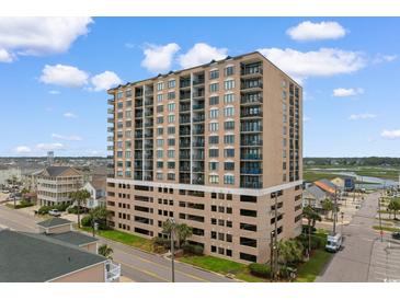 Multi-story condominium building featuring multiple balconies offering views of the surrounding coastal landscape at 4103 N Ocean Blvd. # 707, North Myrtle Beach, SC 29582