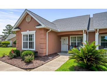 Charming, single story townhome featuring a quaint porch and well-maintained landscaping at 4648 Lightkeepers Way # 39A, Little River, SC 29566