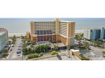 Beautiful exterior shot of a beachside resort featuring convenient parking and gorgeous landscaping at 6900 N Ocean Blvd. # 915, Myrtle Beach, SC 29572