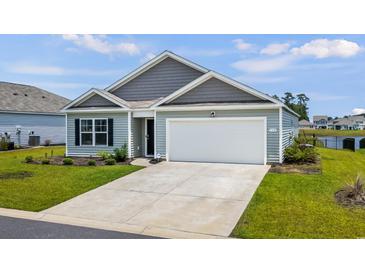 Charming single-Gathering home features a two-car garage, tidy landscaping, and a welcoming facade at 115 Spring Wheat Way, Conway, SC 29527