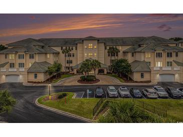 Inviting condo complex with meticulously landscaped grounds, ample parking, and lovely green tile roof at 2180 Waterview Dr. # 1036, North Myrtle Beach, SC 29582