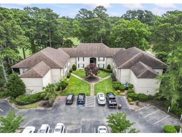 Overhead view of a tan apartment complex featuring well-manicured grounds and convenient parking at 405 Pipers Ln. # 405, Myrtle Beach, SC 29575