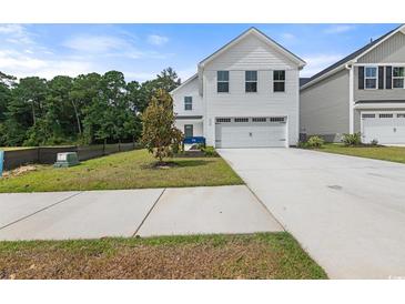 Charming two-story home with a two-car garage and well-maintained landscaping in a desirable neighborhood at 1096 Oak Meadow Dr., Conway, SC 29526