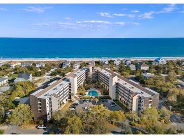 Stunning aerial view of an oceanfront condo complex with a pool and beach access at 423 Parker Dr. # 613, Pawleys Island, SC 29585