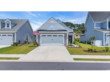 Charming home with a two-car garage, well-manicured lawn, and attractive curb appeal at 598 Cascade Loop, Little River, SC 29566