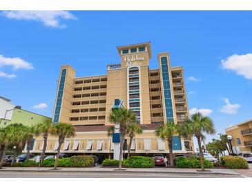 Holiday Pavilion featuring multi-story architecture, balconies, and palm tree landscaping at 1200 North Ocean Blvd. # 206, Myrtle Beach, SC 29577