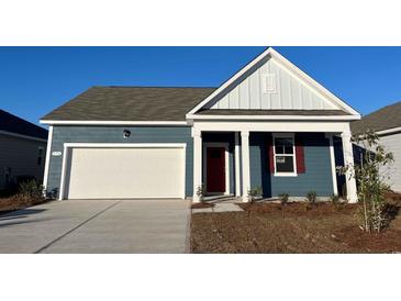 Charming single-Gathering home with a two-car garage and a beautifully landscaped front yard at 173 Dagger Ct., Myrtle Beach, SC 29588