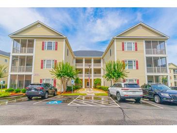 Attractive multi-Gathering building with a well-maintained parking area and landscaped surroundings at 2060 Cross Gate Blvd. # 102, Surfside Beach, SC 29575