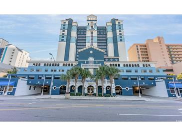 Striking blue and white multistory resort building featuring attractive design details and lush tropical landscaping at 2201 S Ocean Blvd. # 103, Myrtle Beach, SC 29577