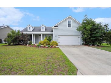 Charming single-Gathering home with a well-manicured lawn and inviting curb appeal on a sunny day at 380 Babylon Pine Dr., Myrtle Beach, SC 29579