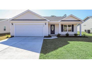 Charming single-Gathering home featuring a two-car garage and a well-manicured lawn at 655 Snowy Owl Way, Conway, SC 29527