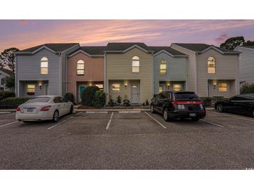 Charming townhomes with colorful exteriors and dedicated parking spaces for residents and visitors at 6703 Jefferson Pl. # G5, Myrtle Beach, SC 29572