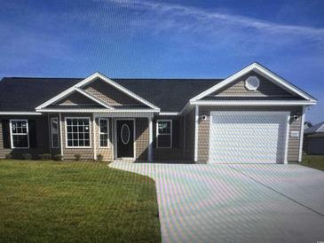 Charming single story home featuring tidy lawn, two car garage, and neutral siding under a blue sky at Tbb 2 St. John Rd., Galivants Ferry, SC 29544
