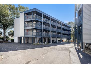 Multi-level condo building with parking underneath offers a beachy, coastal living feel at 1500 Cenith Dr. # B-403, North Myrtle Beach, SC 29582