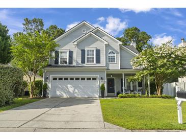 Charming two-story home with a well-manicured lawn, two-car garage, and inviting front porch at 185 Rocko Dr., Myrtle Beach, SC 29579