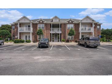 Attractive brick condo building with a manicured landscape and ample parking at 2005 Silvercrest Dr. # 32F, Myrtle Beach, SC 29579