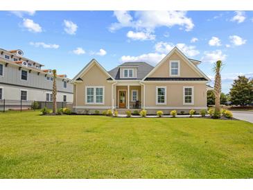 Charming home with a manicured lawn, complemented by tasteful landscaping and a welcoming front porch at 2313 Summersweet Ln., Myrtle Beach, SC 29579