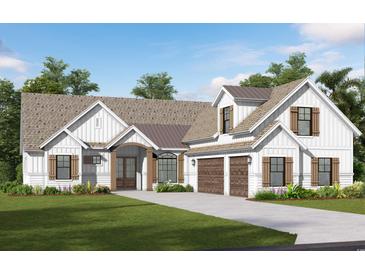 Charming home boasts a symmetrical facade, wooden accents, multi-car garage, and manicured lawn at 558 Oxbow Dr., Myrtle Beach, SC 29579