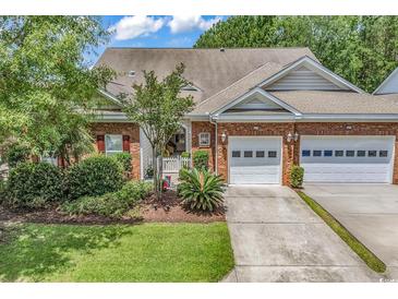 Charming brick home with well-manicured lawn and attached garage at 637 Botany Loop # 64, Murrells Inlet, SC 29576