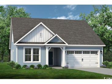 Charming single-story home with light blue siding, white trim, and a two-car garage on a well-maintained lawn at 524 Sheepbridge Way, Loris, SC 29569