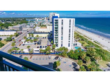 Beautiful exterior view of a white condo building with ocean views and parking at 2001 S Ocean Blvd. S # 1302, Myrtle Beach, SC 29577