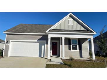 Charming single-story home with gray siding, white trim, and a red front door, enhancing curb appeal at 3550 Ashridge Way, Conway, SC 29526