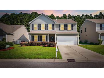 Charming two-story home boasts a well-manicured lawn, complemented by a two-car garage and inviting front porch at 2709 Eton St., Myrtle Beach, SC 29579