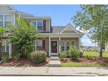Charming two-story home with brick accents, beautiful landscaping, and a welcoming front door at 3017 Mercer Dr. # 0, Conway, SC 29526