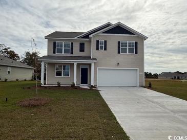 Inviting two-story home with a two-car garage and a well-manicured lawn at 3557 Ashridge Way, Conway, SC 29526