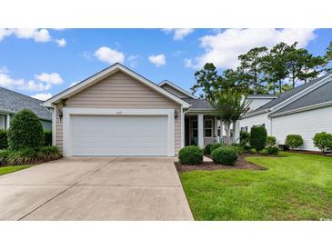 Charming single-story home with a well-manicured lawn and a two-car garage in a lovely neighborhood at 637 Grand Cypress Way, Murrells Inlet, SC 29576