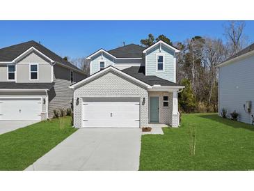 Charming two-story home with a two-car garage, light brick facade and manicured front lawn at 8249 Vibrant Loop, Longs, SC 29568