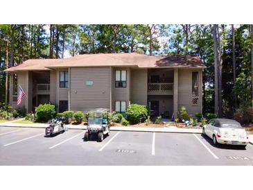 Condo with neutral toned siding and nicely manicured shrubs and bushes in a well landscaped community at 1102 Indian Wells Ct. # 2, Garden City Beach, SC 29576
