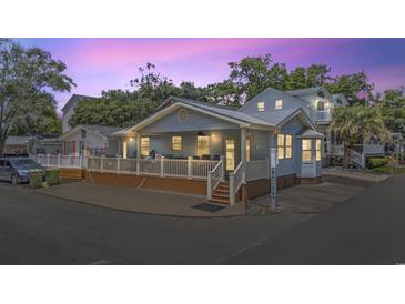 Charming single-Gathering home featuring a spacious porch and a well-maintained exterior at 6001 - Z-49 S Kings Hwy., Myrtle Beach, SC 29575