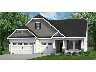 Charming two-story home featuring a three-car garage and inviting front porch, complemented by manicured landscaping at 812 Gallop Dr, Calabash, NC 28467