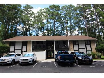 Condo exterior showing multiple parked cars and an open entry way at 950 Forestbrook Rd. # B-8, Myrtle Beach, SC 29588
