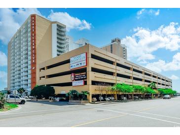 Sands Ocean Club building featuring a parking garage and signage at 9550 Shore Dr. # 225, Myrtle Beach, SC 29572
