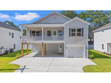 Charming two-story home with a spacious front porch and a one-car garage at 2426 Park St., North Myrtle Beach, SC 29582