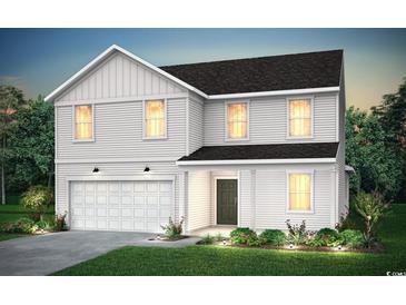 Charming two-story home with white siding, a dark roof, an attached garage, and manicured landscaping at 1047 Laconic Dr., Myrtle Beach, SC 29588