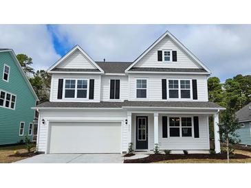 Charming two-story home with white siding, black shutters, and an attached two-car garage at 383 Wingspan Ct., Myrtle Beach, SC 29588