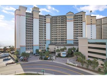 A large condo with palm trees, covered parking and sign saying Beach Cove Resort at 4800 Ocean Blvd. S # 1119, North Myrtle Beach, SC 29582