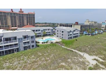Coastal condos overlook a pristine community pool and provide easy access to sandy beach and ocean views at 1820 N Ocean Blvd. # 303D, North Myrtle Beach, SC 29582