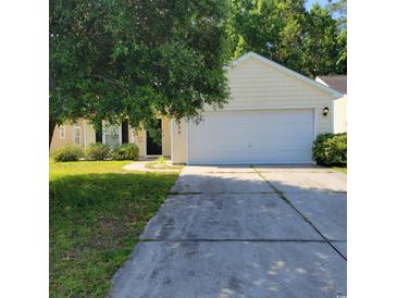 Charming single-story home featuring a two-car garage, landscaped yard, and inviting curb appeal at 396 Bellegrove Dr., Myrtle Beach, SC 29579