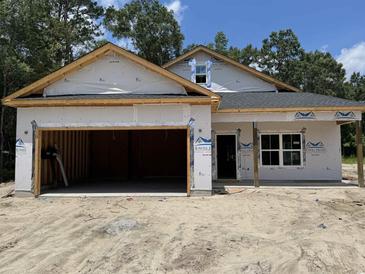 An exterior view of a house under construction with an attached two-car garage at 4032 Copperhead Rd., Conway, SC 29527